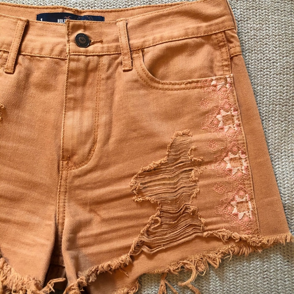 Distressed burnt orange embroidered jean shorts